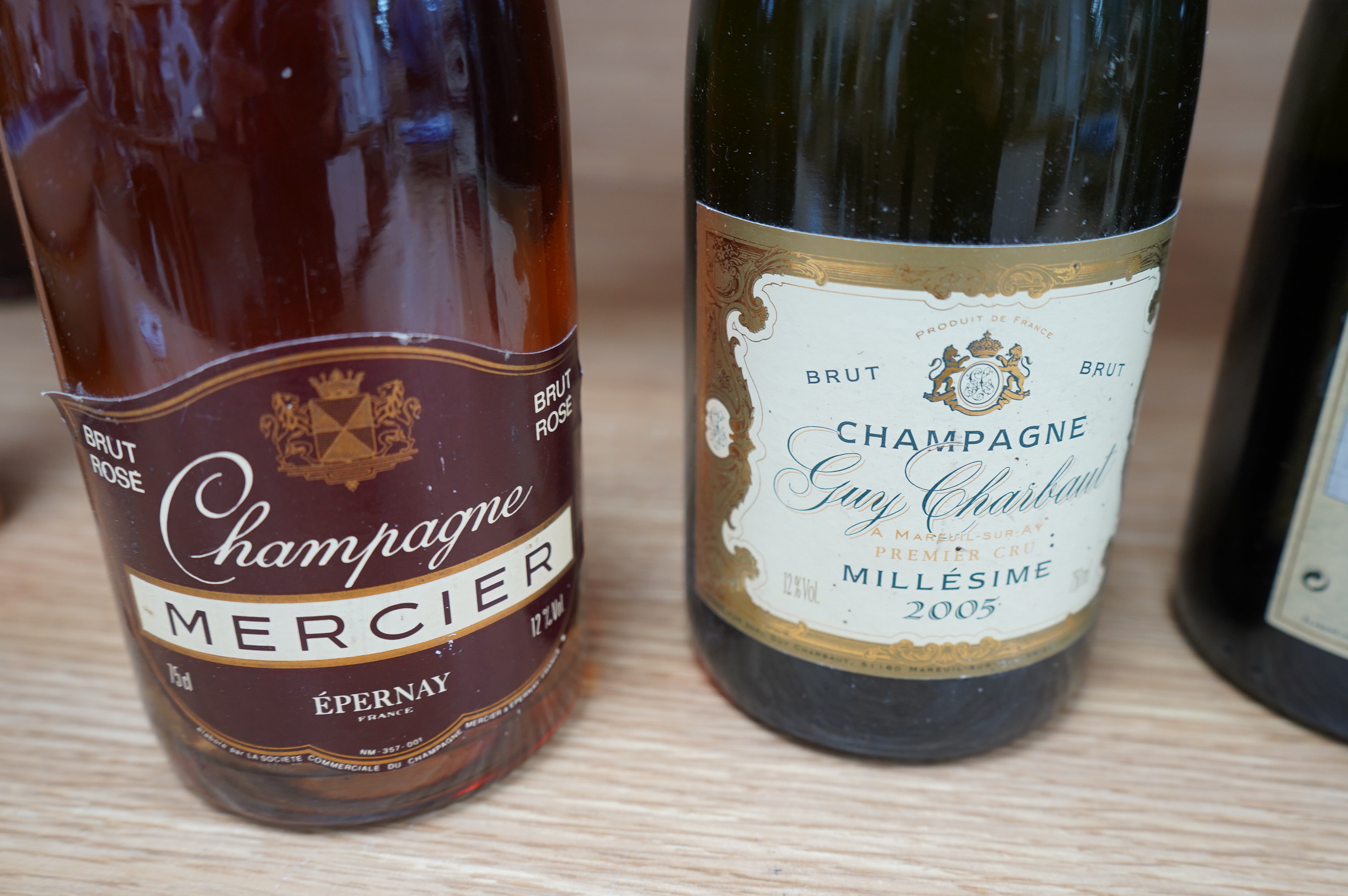 A boxed 1985 Moet Chandon Imperial Brut Rose, Two Guy Charbaut 2005 Champagnes, a bottle of Bouzy Rouge 1989 and a bottle of Mercier Rose (5). Condition - unknown storage